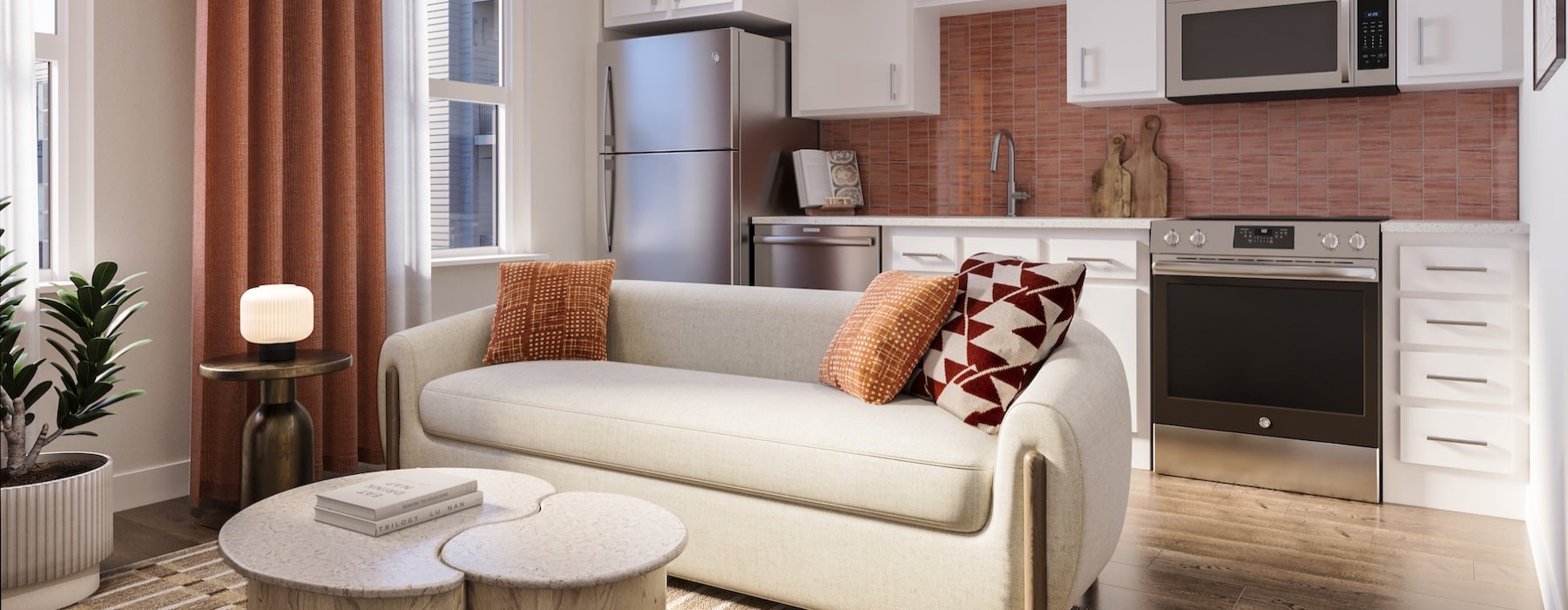 a kitchen and living room with a couch