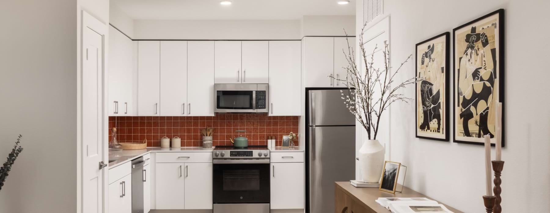 Modern apartment kitchen with designer finishes at Odell Apartments