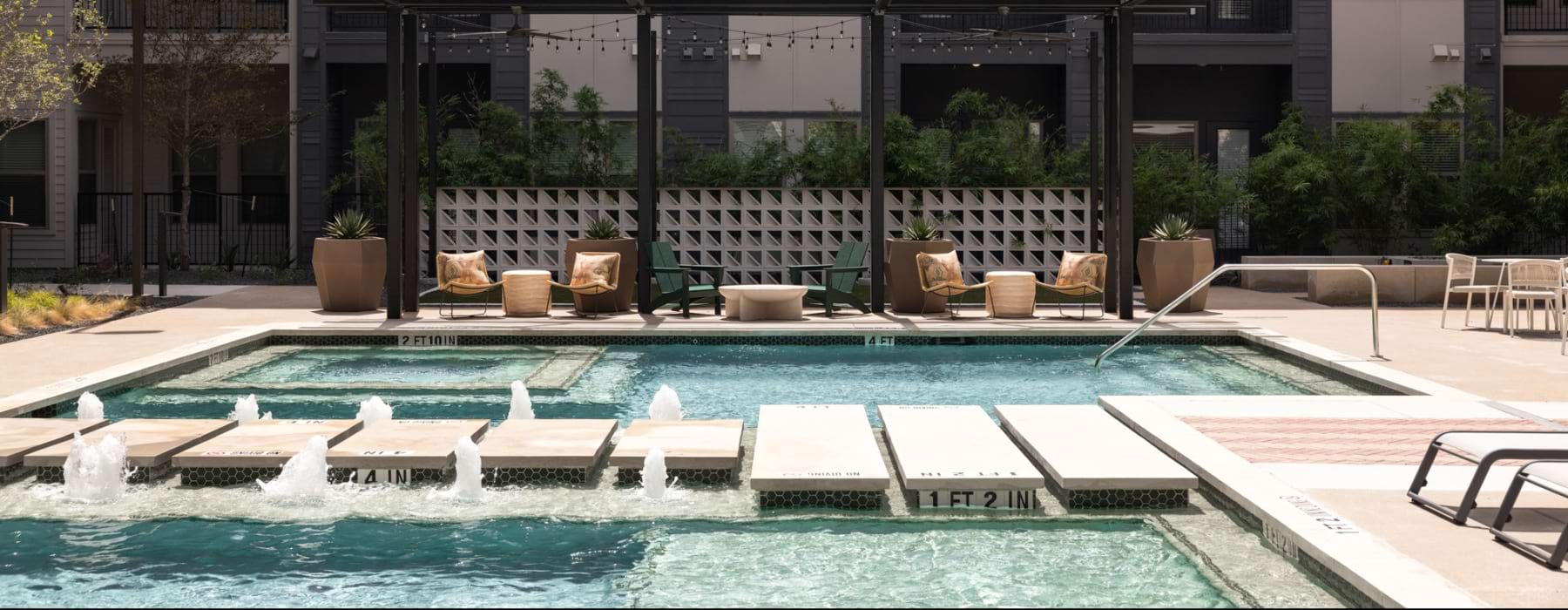 a swimming pool in a courtyard between buildings