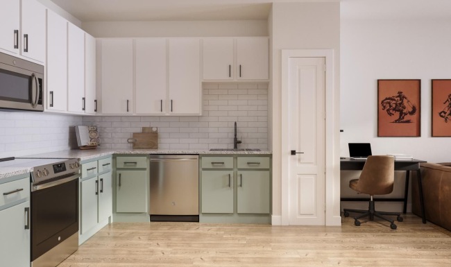 a kitchen with white and green cabinets