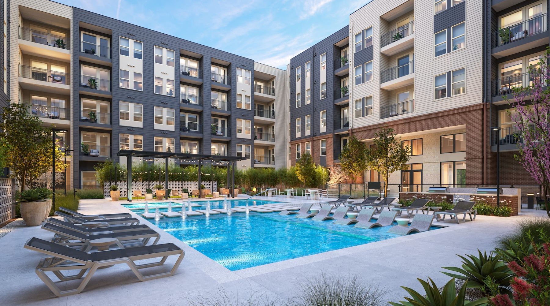 a courtyard with a pool and lounge chairs